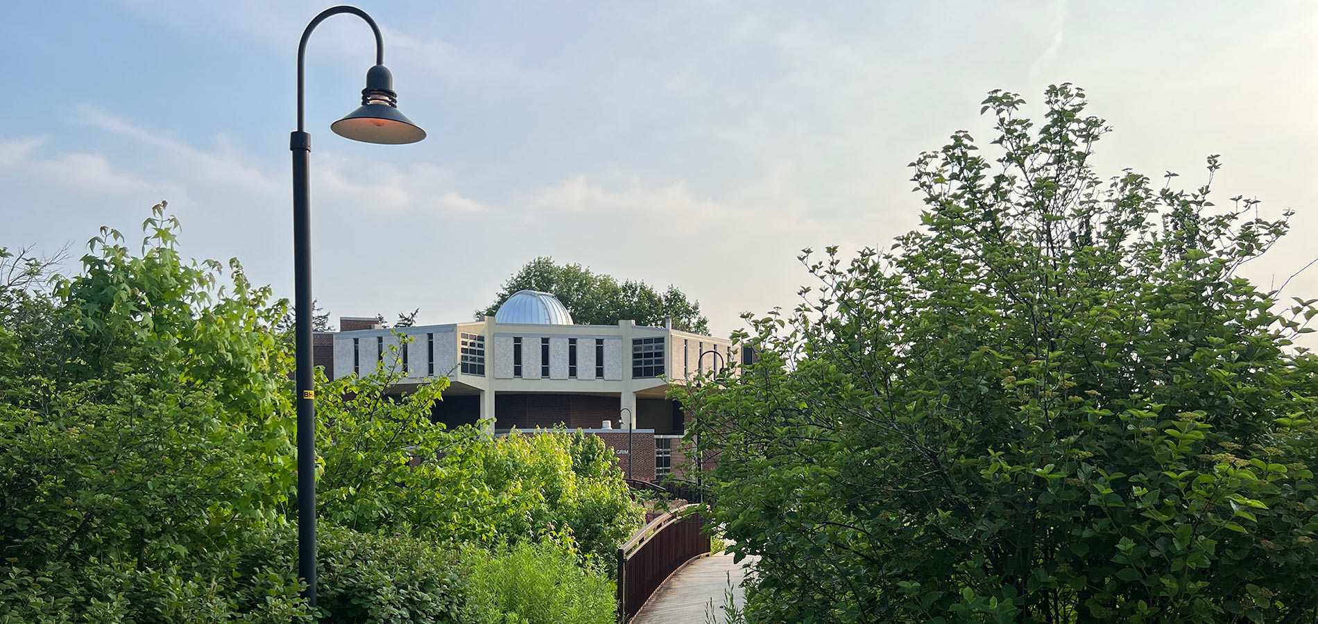 A view of the Grim Science Building from the Boehm Science Building, note the observatory