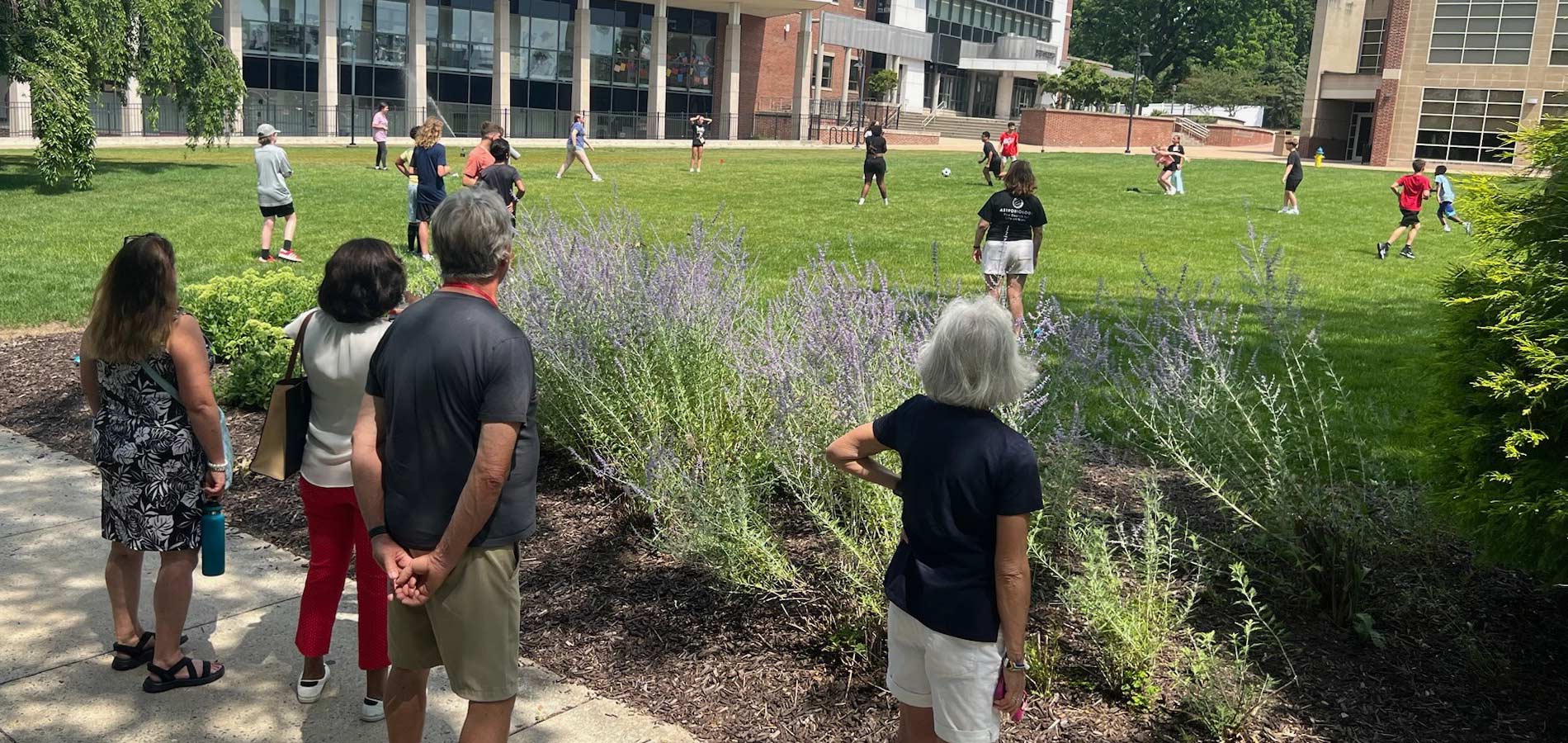 STEM YEA 2025 provided ample opportunities for students to learn and engage. Additionally, there was dedicated time allocated for them to enjoy outdoor recreation. Rotarians witness the students' enthusiasm as they participate in a game of kickball.