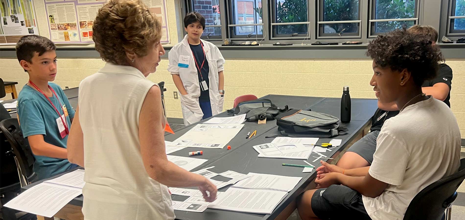 Former educator and indispensable STEM YEA Project Manager Gwenn Carr confers with students.