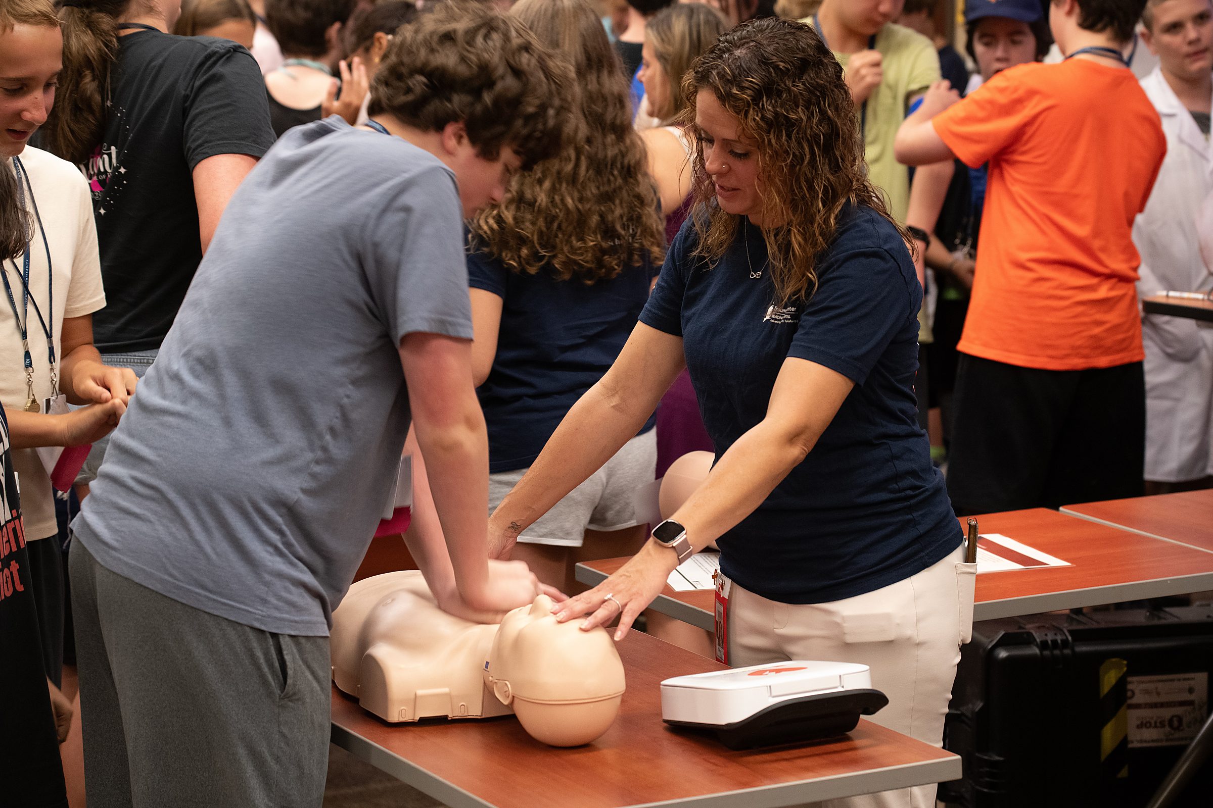 Reading Hospital (Tower Health) employees Jennifer Barney (shown here) and Teena Lee provided life saving information on defibrillators, wound dressing, tourniquets and bicycle safety to STEM YEA students.